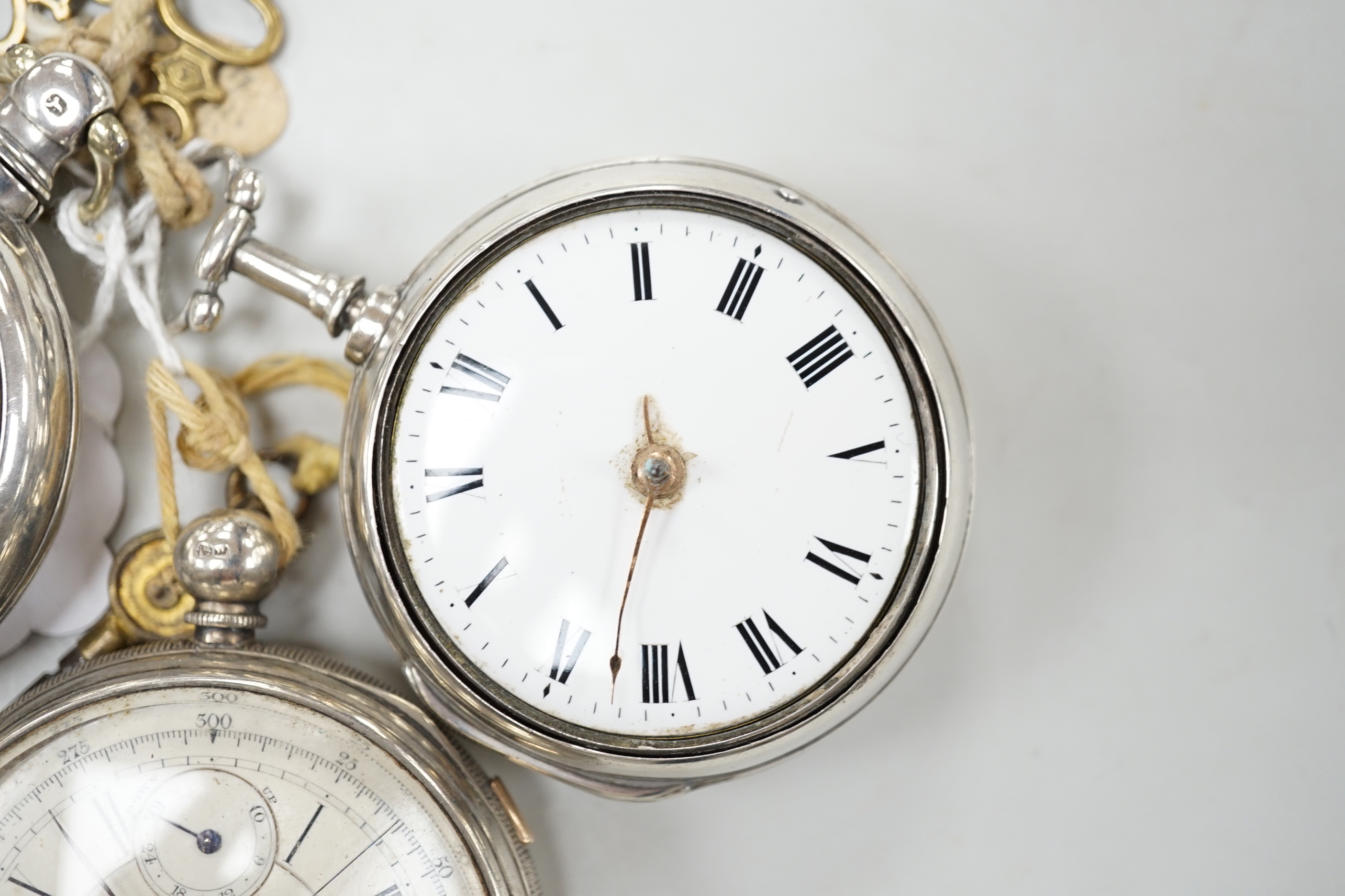 Three assorted silver pocket watches, including two pair cased and an open faced chronograph, by Aaronson, Manchester.
